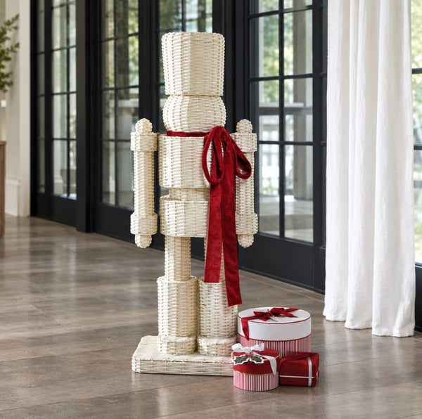 White All Weather Rattan Nutcracker  w/red Velvet Bow